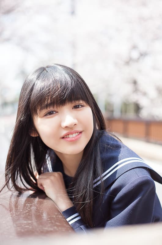 Bare toes peeking from a half-removed cotton sock, intimate framing and warm, romantic tones